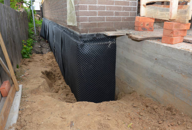 SJ Waterproofing Pros technician performing targeted Emergency Waterproofing assessment in Morris, IN